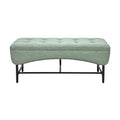 Moderne groene ottomaanse bank met metalen frame